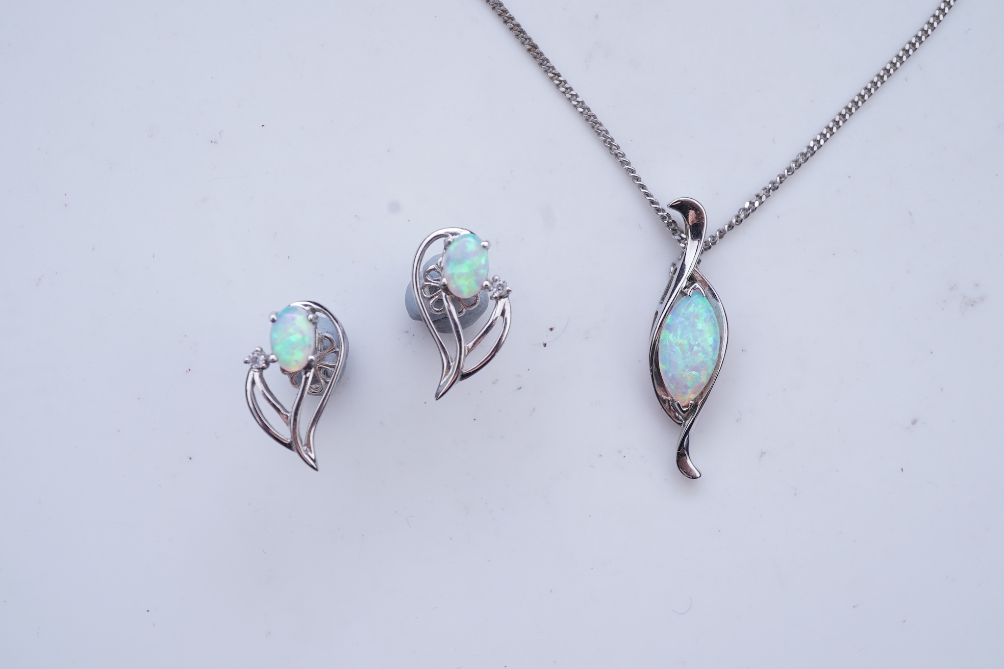 A synthetic opal demi-parure